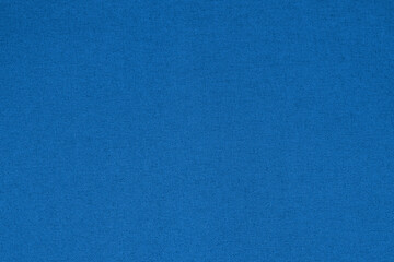 Blue woven fabric texture with a fine pattern. Ideal for textile backgrounds, upholstery, and fashion design.