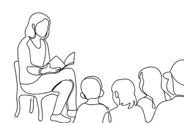 Teacher Reading Storybook to Attentive Children in Classroom