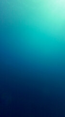 Vertical Background thickness of water. View of the Ocean in section. Gradient of light underwater. Rays of the sun pass through the thickness of water and dissolve in the depth of sea.