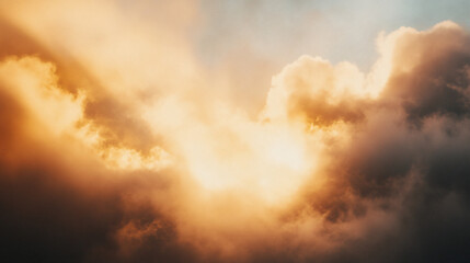A breathtaking view of clouds illuminated by sunlight, creating a dramatic interplay of light and shadow in the sky.
