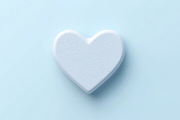 Fototapeta premium Light blue heart-shaped object on a pale blue background