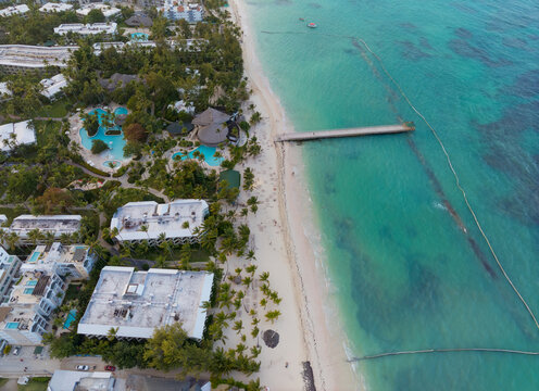 A beach with a few buildings in the background