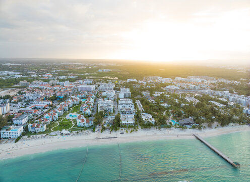 A beautiful beach with a city in the background