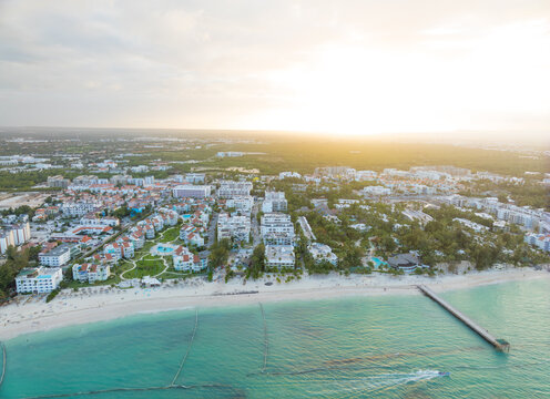 A beautiful beach with a city in the background