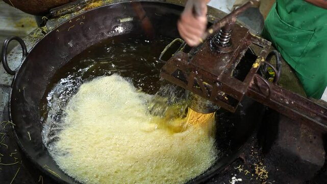 Making of Bengali spicy food chanachur.