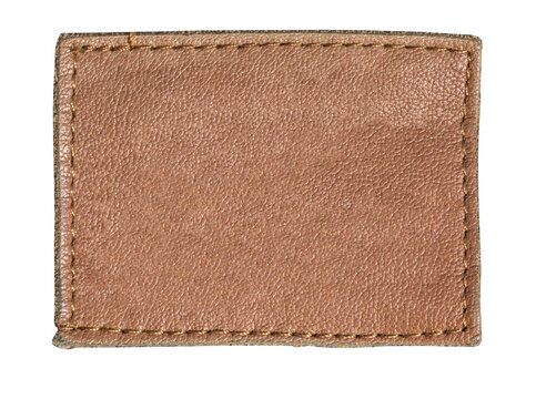 Blank brown leather label showing grain and stitching isolated on white background