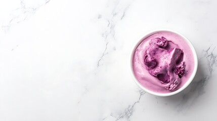 A minimalist shot of açaí in a white bowl