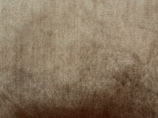 Brown glossy suede fabric with its contour and shabby contour. Vintage golden brown seamless background texture. Good for pillow or bed linen cover. Seamless background texture.