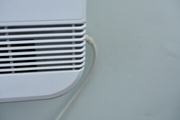 Air conditioner on the wall in the room. Selective focus.