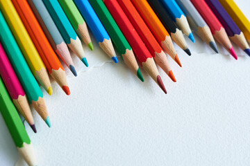 Colored pencils isolated on white background. Back to school.