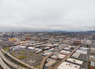 Fototapeta premium A cityscape with a lot of buildings and a freeway