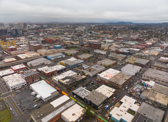 A city view with many buildings and a few cars