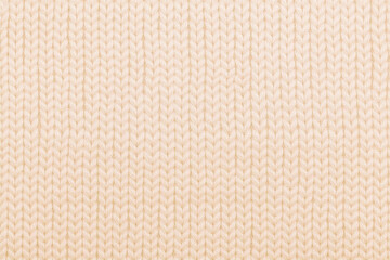 Background of the wool yarn. Woolen fabric texture closeup. Textile texture background. Detailed warm yarn background.