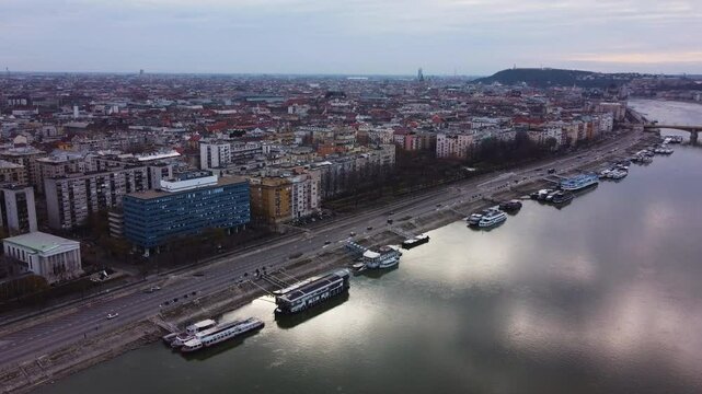 Aerial cityscape of Budapest at sunrise, Danube River, bridges, and historic landmarks, reformed church on Pozsonyi Street, Margitsziget or margit hid bridge