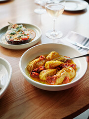 Sardinian Culurgiones Pasta in Oven-Roasted Cherry Tomato Sauce with Pinot Grigio and Roasted Eggplant Appetizer