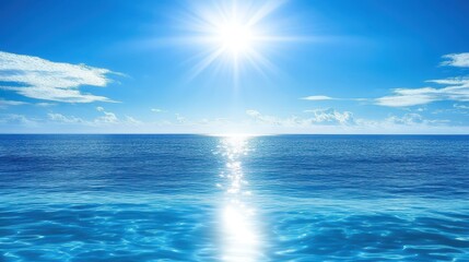 Obraz premium The sun shines brightly over calm ocean waters, creating a sparkle on the surface. A few clouds float in the clear blue sky during midday, enhancing the serene atmosphere