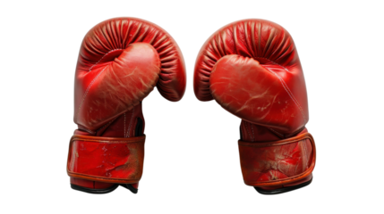 Pair of worn red boxing gloves on transparent background