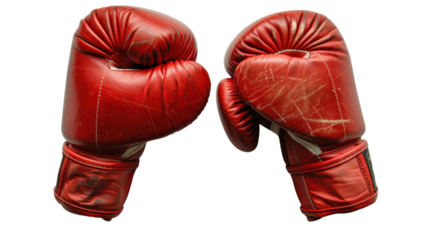 Two worn red boxing gloves facing each other on transparent background