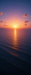 Fototapeta premium Vertical Sunset Over Calm Ocean Horizon with Fiery Sky