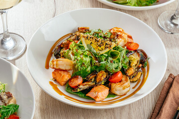 vegetable salad with greens, sesame, shrimp and sauce