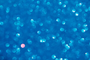 A blue bokeh-style background with defocused light creates an elegant space for text or design elements.