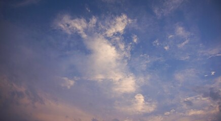beautiful blue afternoon sky, with white and yellow clouds, perfect for background