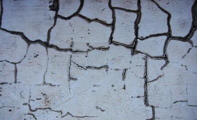 Fototapeta premium Cracked and broken gray wall, looks unique and suitable for background