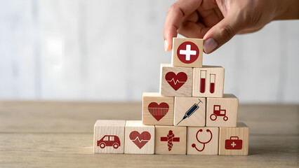 Building a Healthcare Pyramid with Wooden Blocks Featuring Medical Icons