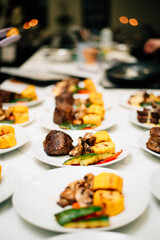 Grilled vegetables on a white plate in portions