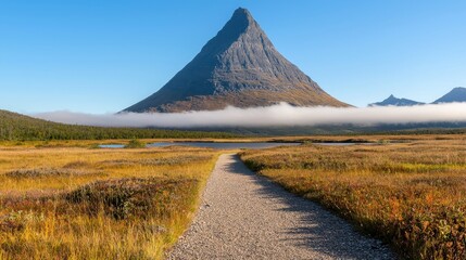 Obraz premium Clear Pathway Leading to Majestic Mountain Under Bright Blue Sky and Soft Clouds