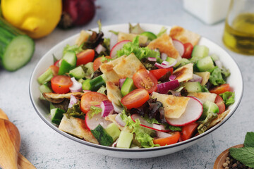 A bowl with Fattoush - Traditional Levantine salad	