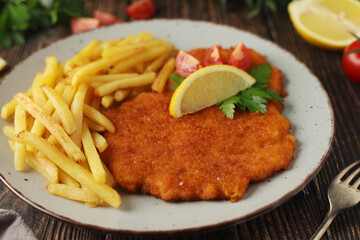 A Viennese schizel with french fries	