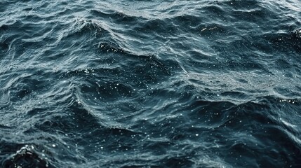 Obraz premium Deep Blue Ocean Waves with Gentle Ripples and Sunlight Sparkling on Surface Water