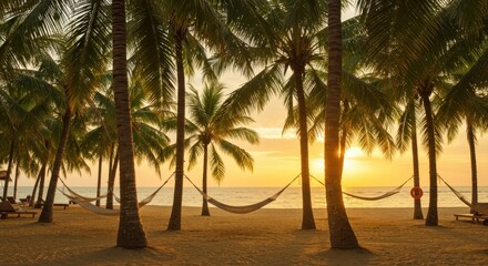 Obraz premium Tranquil beach scene with hammocks under palm trees at sunset, serene atmosphere