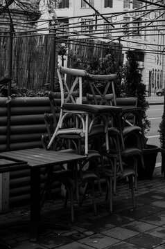 March 16, 2025 - Belgrade, Serbia. Colorful chairs are stacked in front of the Polet restaurant, indicating that the restaurant's garden is not open.