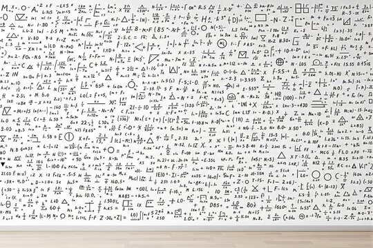 Mathematical formulas on white wall in classroom.