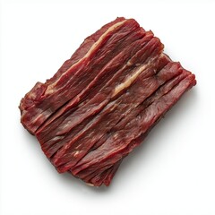 Fototapeta premium Dried beef jerky strips on a white background.