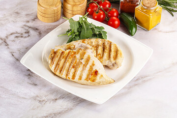 Grilled chicken breast served arugula