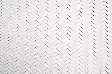 abstract white background with artificial plastic texture of woven rattan. Abstract braided Pattern