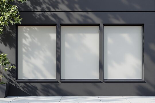 Blank storefront window mockup with three empty frames on dark wall.