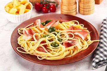 Pasta spaghetti with olives and jamon