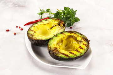 Sliced fresh avocado on the grill