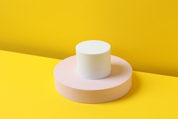 Various podiums on a yellow background