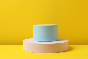 Various podiums on a yellow background