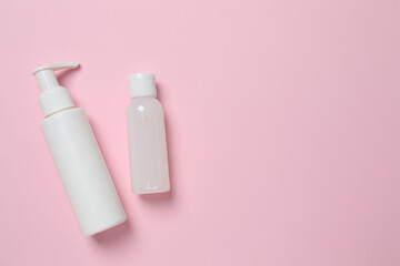 Natural cosmetic products a pink background, top view