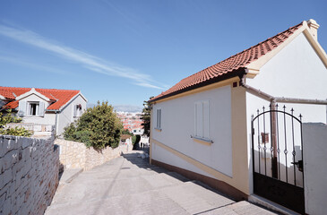 Charming Stone Houses Along a Narrow Sunny Hill Street..