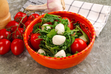 Salad with mozzarella and arugula