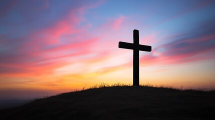 Silhouette Cross at Sunset Over Rolling Hills