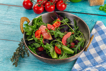 Salad with salmon and arugula