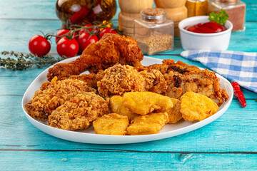 Golden crispy fried chicken mix - wings, drumsticks, nuggets and strips